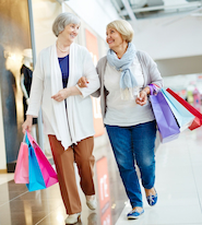 two seniors walk in a Denver shopping mall